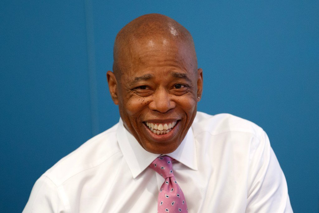 Mayor Eric Adams smiling for a photo.